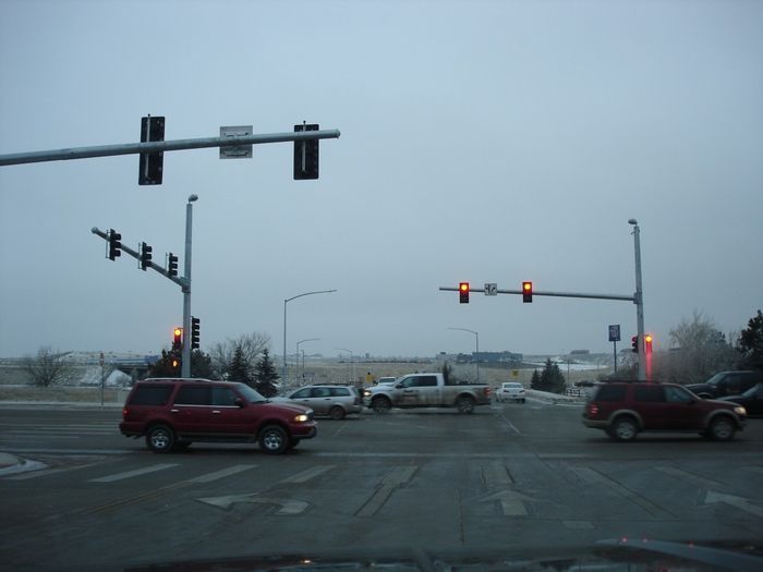 Traffic Lights
Here is a traffic light scene in Rapid City,SD with what I believe are Mongoose type street lights and LED street lights in the background.
Keywords: American_Streetlights