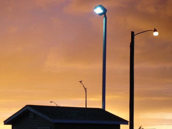 Fixtures Lit
A pic of a HPS GE 201-SA and a metal halide flood fixture lit at dusk, with a nice sunset illuminated storm cloud base in Jamestown, ND.
Keywords: American_Streetlights