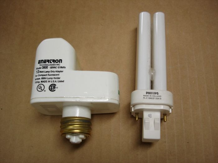 Enertron 3800 Adapter
Here is a Enertron 3800 15W compact fluorescent adapter for 13W lamps complete with a Philips PL-C quad tube warm white lamp.

Made in: (Adapter) USA  (Lamp) Holland

Manufactured: June 1994
Keywords: Lamps