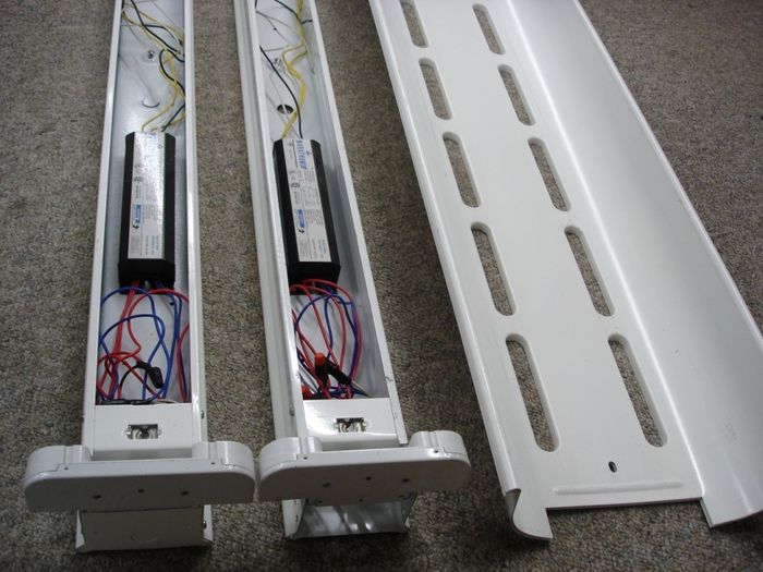 Peerless Fluorescent
Here are two Peerless Industrial 4 foot fluorescent fixtures with reflector.They contain Marathon electronic ballasts.

Made in: Montreal Quebec, Canada

Manufactured: Sept. 1990 
Keywords: Indoor_Fixtures