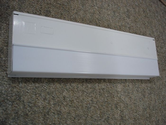 Lithonia Fixture
Here is a Lithonia 15W under-cabinet fluorescent fixture,this lacks a switch and cord,it is mainly used for a hard wired installation.

Made in: China

Manufactured: August 2004
Keywords: Indoor_Fixtures