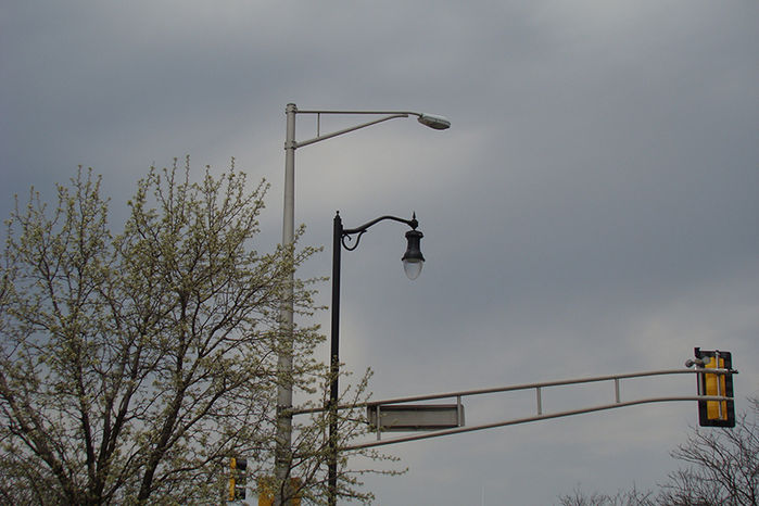 Out With The Old...
Downtown Des Plaines. Ironically, the taller light in the background (soon to be removed) was part of a relighting project about 20 years ago, replacing the once prominant Form 109. Poetic justice, perhaps?
Keywords: American_Streetlights