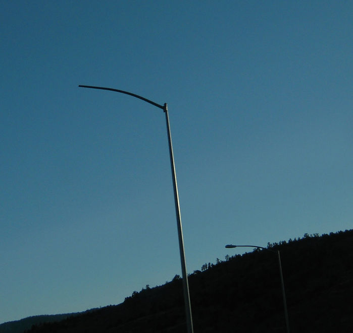 Where is my head?
This streetlight is missing a fixture.

Used to have a AE 125 on it, but it fell. I searched on the ground but nothing there.

On C-470.
Keywords: American_Streetlights