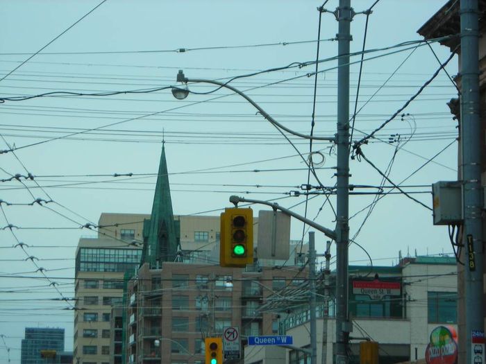 [Gone] Older 8-8-8 Traffic Signal 
Here's a older 8-8-8 traffic signal style that's no longer installed in Toronto. These used to be pretty common in Toronto before they started using 12-8-8s and 12-12-12 signals. There's still a handful of these still in Toronto but they are being quickly replaced by 12-8-8s or 12-12-12s, usually poly Fortrans, Econolites or LFEs.

This one was replaced by a poly LED 12-8-8 around a month after this was taken, there are probably none of these left in Toronto now with the last 8-8-8s I know of being removed in early 2012. Well, aside from the streetcar, bus and bicycle ones which were retrofitted to LED in 2009-2011. 
Keywords: Traffic_Lights