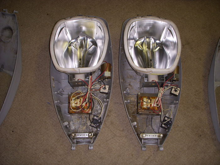 Double the OVX, insides
Here are my two other OVX's opened.

The reflectors are different! They are more OV-15 than Cooper, and yet.. these two fixtures were made in AUgust 2001 JUST LIKE my first OVX! So this means the OVX used a different reflector for their FCO versions then their drop lens version! Nice discovery I made!
Keywords: American_Streetlights