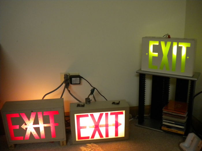My Exit Sign Collection
Here are all three of my exit signs. All three are made by Prescolite. The left one is a 1950s preheat fluorescent model, the middle one is a late 60s/early 70s incandescent model, and the right one is a 1993 incandescent model. All three work great!
Keywords: Indoor_Fixtures