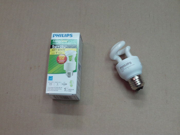 Philips EnergySaver 5W Soft White CFL: tiny!
This is definitely an oddball. It's the first time I've seen CFLs made for such low wattage incandescents. However I don't think they'll get extremely popular since their incandescent equivalent aren't going to be banned by 2012, nor 2020 (as of today).

I couldn't resist upon my visit at Trois-Rivire's Home Depot to take one of those LOL. The ballast casing looks huge compared to the tiny tube! There's not even one complete twist LOL.
Keywords: Lamps