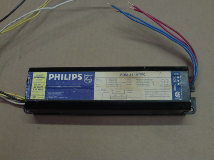 Philips RQM-2S40-TPC rapid start ballast.
It's impressive how plentyful those ballasts are in Canada! 7 times out of 10 old scrapped fixtures I find have Philips ballasts!

Anyway... this specimen still works, although it has the same problem as several others I have, lamps seem to rectify, even brand new ones. Ground fault has been tested, no ground fault (~ 15V from case to ground), so I don't know what could cause this.
Keywords: Gear