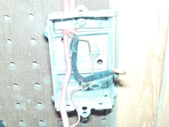 Ugh! Check this out!
Today I finished wiring an outlet for my emergency light. I chose the vacuum outlet to start the new part since it's the closest one. But upon removing the outlet to add the new Loomex cable, EEK! See the black wire? This could've shorted at any time!

And no, you are not seeing things, this outlet is indeed connected to a RED Heatex cable, designed for 240V heaters! The red is used as a neutral, I even checked it with my clamp meter to be sure LOL. Not only the wrong cable type is used, but the way it used to be was dangerous. Needless to say I cut those wires and stripped a new length of wires. However it'd be too much trouble to change the whole cable LOL. The last thing that violates the code is the usage of a 15A outlet on this 20A circuit. There were other things that I did not like at all, like the way the wires were connected to the outlet. A good 1/4" of copper was exposed and the hooks were badly made, unlike mine! ^__^

This is likely the most code-violating circuit in the whole house! The circuit part I added however does not violate the code in any way XD.
Keywords: Miscellaneous