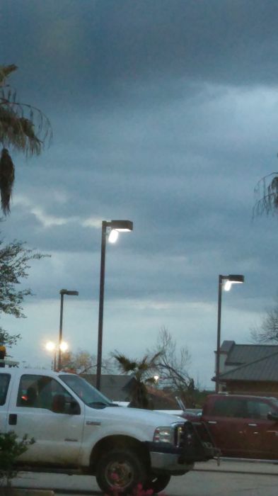 Weird...
Theres a rather weird (maybe ebay) LED flood lights above the regular metal halide parking lot fixtures. Yet, the wire is sticking out from the LED flood light. Probably not to code, if you can see the wire. This was also taken Monday.
Keywords: Lit_Lighting