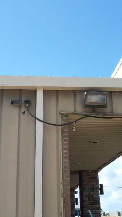 a metal halide wall pack, and two stem mount P-Cells
At a shopping center, near a self serve car wash.
Keywords: Miscellaneous