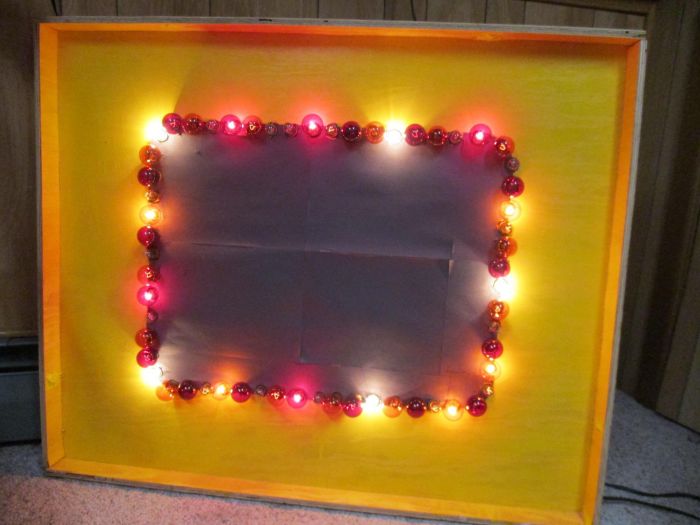 My Price is Right Light Border
I've remade my Price is Right light border.
Made of plywood, yellow paint, black construction paper, 4 patio light strings, red and orange G40 C9 bulbs, clear S6 indicator bulbs and a chase controller that they plug into.
See the video [url=https://www.youtube.com/watch?v=Z2xO8pO_eb0]here[/url]
Keywords: Lamps