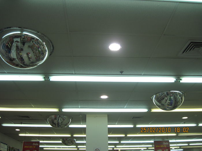 US Philips Alto F96T12 HO lamps in "New Pharm" shop in Canyon Haifa mall
Being ALTO, they aren't more bright then a standard daylight T8 of 36W fluorescent lamp of the same phosphor type.
The fixtures are Gaash or another israeli manufacturer and the ballasts are Eltam rapidstart autotransformer ballasts for one T12 of 105W, with the same ignition fashion of the american magnetic rapidstarts (Several Rapidstart ballasts for 20W & 40W of Eltam preheated the electrodes before applying current and several operated on the fashion of the trigger starts).
These lamps tends to reach EOL before all of their mercury consumed, since i never saw these type of lamps in mercury starved mode, despite they are ALTOs.
Keywords: Lit_Lighting