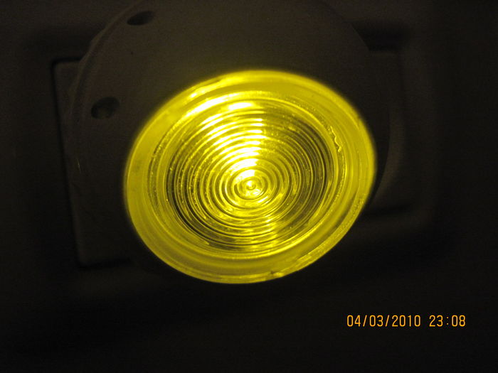 The Osram Lunetta nightlight in my father home, lit
The light is very slightly yellower then a LPS lamp, but not as much as in this picture.
The light intensity from this nightlight is perhaps similar to those UK neon glow nightlights.
Keywords: Lamps