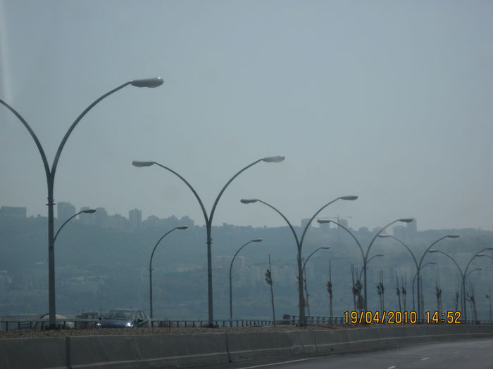 Low lampposts with Copper OVYs in a road to Haifa that bypass the Checkpost center
They have HPS lamps, 250W i think.
Keywords: American_Streetlights