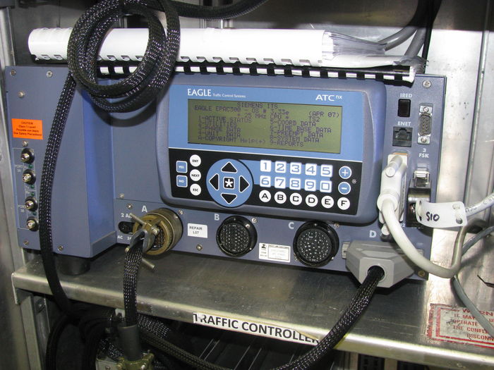 Eagle EPAC M50 traffic signal controller
Here's an up close shot of the main computer running the collection. The EPAC M50 series made by Eagle is one of the most powerful traffic controllers used today and many cabinets in the "real world" have these inside. Aside from basic timing these have a wide variety of coordinating and networking options, it can talk to other intersections, scheduling, phase structuring, detector options and features, pre-emption features, reporting and system functions. The EPAC M50 was a complete update on Eagles 25 year old EPAC-300 series controllers. This runs on a new engine that can support SE-PAC and many other Eagle softwares....all on this nifty little machine.

Eagle's Price: $3,200
Surplus shop price: $400 

Deal!

For those who know the industry standards. Its running NEMA TS2
Heres the [url=http://www.temple-inc.com/images/pdfs/conflict/siemens%20epac%20m50%20controller.pdf] specs on the controller [/url]
Keywords: Traffic_Lights