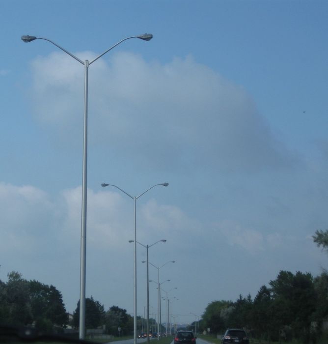 A little Over Kill 
This 4 lane road has dual head 50 foot poles with 400 watt HPS OVXs each OVX only does two lanes? It is insane! 
Keywords: American_Streetlights