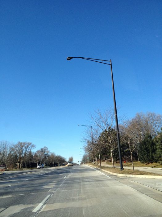 Black GE M250A2 w/ Glare Shield
Owned by Schaumburg, Illinois, which has lots of black streetlights, mostly GE M250A2's and M400's. This one has an unusual looking glare shield on it. It's also unusual that they use an M250 on a large road like this. Other lights on this road are 400w M400's.
Keywords: American_Streetlights