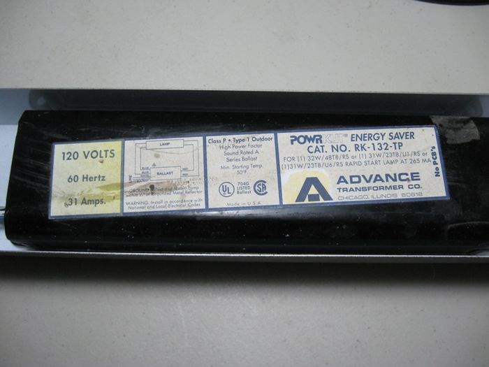 Advance "PowrKut" hybrid ballast
Advance PowrKut ballast for one F32T8 fluorescent lamp. This is primarily a Rapid-Start magnetic ballast with some electronic circuitry added to the starting circuit to "Kut" the power to the filaments after the lamp has started to help save energy.
Keywords: Gear