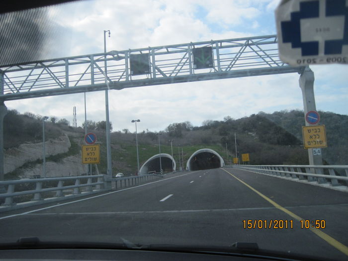 The enterance to one of the tunnels in Highway no.6
There are two LED sign with green arrows, two barriers with two 8" traffic lights, cameras and unknown brand roadlights.
Keywords: Miscellaneous
