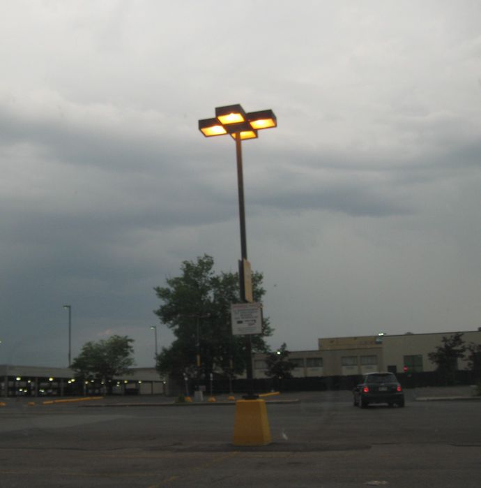 Lots of Light!
I personally would of used a taller pole, here are four 400 watt HPS shoe boxes mounted 16-20 feet off the ground!
Keywords: American_Streetlights