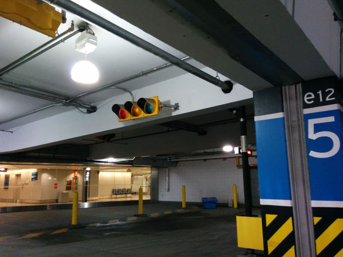 Parking Garage Signals
 The crosswalk at the airport parking garage interestingly has a set of signals. The signals are both Dursigs, still incandescent too.
Keywords: Traffic_Lights