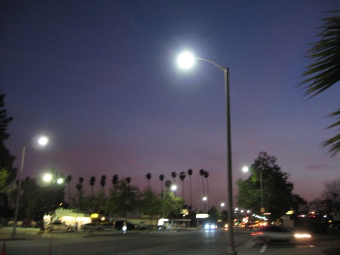 Pomona Streetlights Lit
Induction streetlights in Pomona lit up at dusk.

The two headed pole in the parking lot seen across the street are Deluxe White Mercury Vapor, probably 400 watts
Keywords: Lit_Lighting