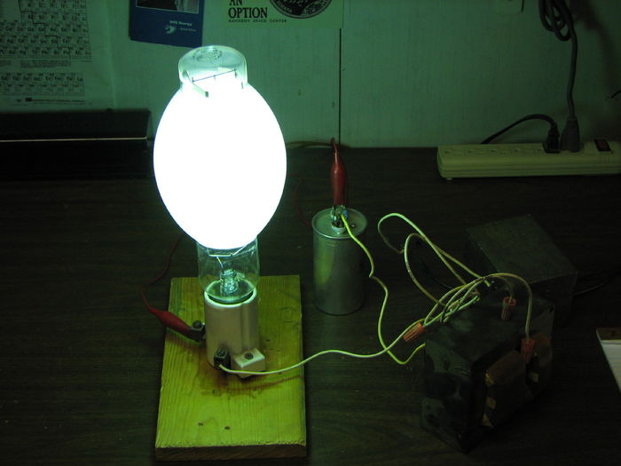 Westinghouse 400w Mercury Vapor /W (White)
Lamp is at about 30% run-up on M-57 metal-halide ballast. At full brightness, it appears to have a very pleasant color. This is the first "new" /W lamp I have seen up close. The red rendering doesn't seem as bad as I'd imagined.
Keywords: Lamps