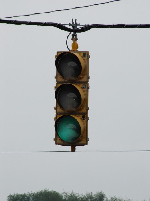 The green is fading away
As you leave the programmed area of view on an Intelight, the light starts to fade out, just like the older programmable signals made by 3M or McCain. 
Keywords: Traffic_Lights