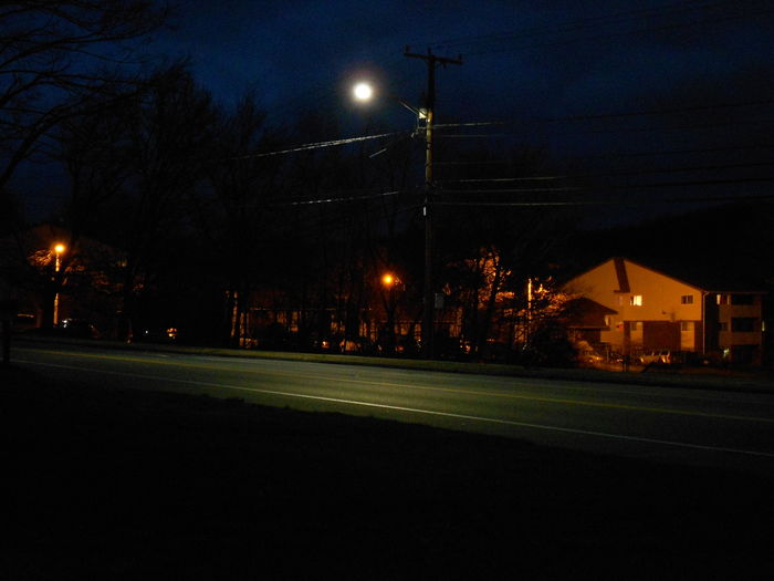 LEOTEK Night scene
As a request from Mike, Here is the LED light in front of my house lighting up the street.

You can still see the HPS glow from the apartment complex up the street. Those thankfully are not maintained by HG&E.
Keywords: Lit_Lighting