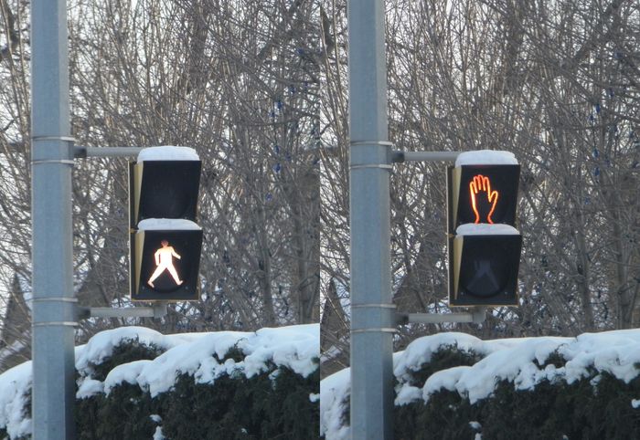 [Gone] Incandescent Ped Signal 
Here's a older incandescent pedestrian signal that's getting harder to find here after most municipalities here converted their pedestrian signals to either LED or LED with countdown. It has the Canadian style walking man which I like better IMHO, than the US one or the LED ones which are usually a outline of the man instead. 
Keywords: Traffic_Lights