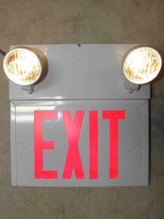 Exit Sign and Emergency Light Combo
Here's my LED exit sign and emergency light combo, shown here running on the battery. The exit sign is a 120/347v AC 6V battery LED and the emergency lights are 6V 9w incandescent. Mine is spec'd for 30 min operation...I believe shorter than most dedicated emergency lights though. See spec sheet [url=http://www.aimlite.com/PDF%20Aimlite%20eng/cxst%20csst%20en.pdf]here.[/url]
Keywords: Misc_Fixtures