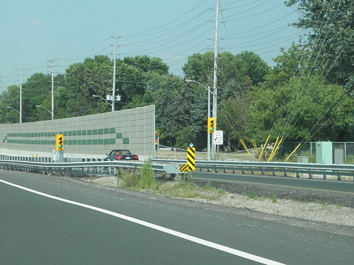 Ramp Meter Signals
Here's a shot of a pair of 8" signals used for ramp metering on the QEW's Toronto bound onramps in the Mississauga area. They're only used to control traffic entering the freeway during weekday mornings, otherwise they stay green.  [url=http://www.mto.gov.on.ca/english/traveller/trip/compass-sio.shtml#mississauga]Here's[/url] some more info on the MTO site. 
Keywords: Traffic_Lights