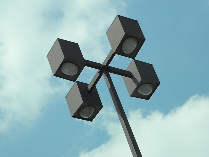 Parking Lot Lights 
Could these be the Powerlite [url=http://www.galleryoflights.org/mb/gallery/displayimage.php?pos=-7490]Poubelle's[/url] cousins, they look a lot like a Poubelle aside from the brown paint and the square body. 

Close up on the refractor:
[url=http://i560.photobucket.com/albums/ss50/joseph_125ON/Meta/e91e6d78.jpg][IMG]http://i560.photobucket.com/albums/ss50/joseph_125ON/Meta/e91e6d78-1.jpg[/IMG][/url]
Looks a bit like [url=http://www.galleryoflights.org/mb/gallery/displayimage.php?pos=-7166]this refractor[/url] to me. 
Keywords: American_Streetlights