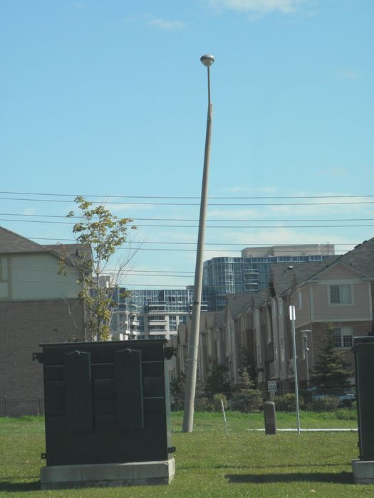 Tilted Pole
Tilted direct bury concrete pole that was probably hit by a car. 
Keywords: American_Streetlights
