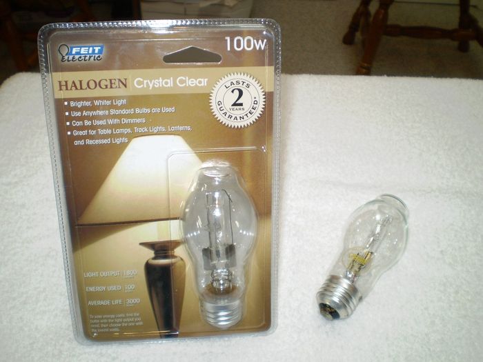 Feit Electric Halogen Crystal Clear 100 Watts
Here I pick this up at the Battery Plus store at Cobb Parkway (by the Big Chicken), Marietta, GA, USA on Armistice Day (2011-11-11).

This one is newer version compare to [url=http://www.lighting-gallery.net/gallery/displayimage.php?pos=-41427]Feit Electric 100 Watts Halogen Clear BT15[/url] that I have posted at Lighting Gallery site.  With the loss of only 15 lumens due to the filament support inside the capsule.

Fabrication Location: China
Keywords: Lamps