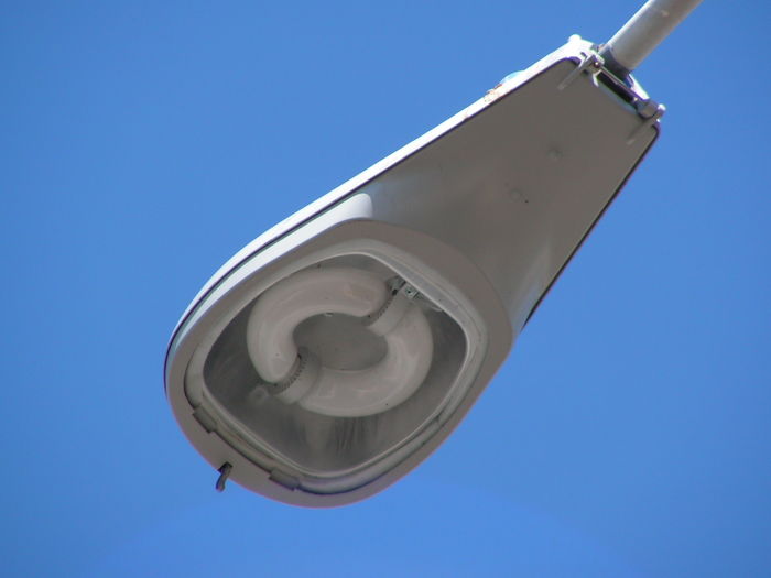 the old induction light fixture not even 
up there a year i guess it was a test or something then they went with another model and make these are all gone now the new weird ones are all over the  hood now i do like the 5000k glow at night
Keywords: American_Streetlights