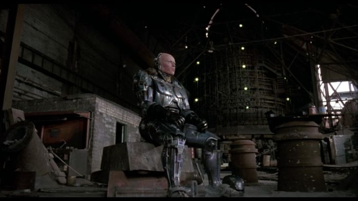 Robocop (1987) 1:22:05
At the steel mill. Near Murphy's head you can see a MV High-Bay Fixture. Dunno what are the lit MVs on the weird cylinder.
Keywords: Misc_Fixtures