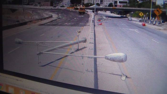 Well there goes a weird but cool double guy wire pole :( 
Gone for road work in downtown. It may still be there since I found this online. But I've never seen a pole like this so I wanted to share it with you all. 
Keywords: American_Streetlights