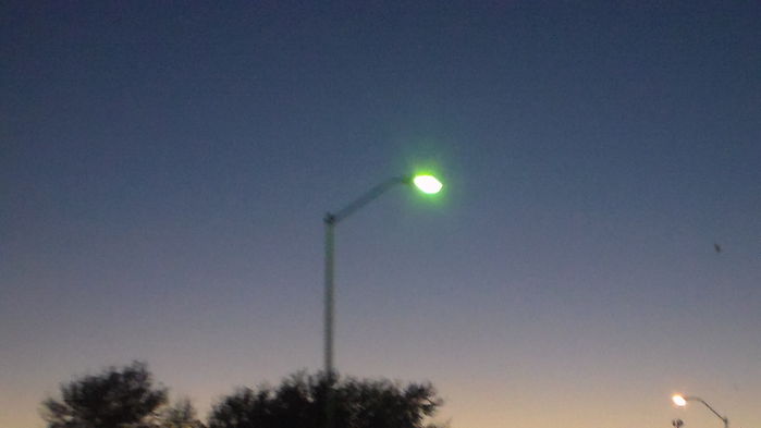 More Plano Pkwy dusk shots with an evil HPS light interrupting the line of mercs -_-
this is on a newer pole. AEL 125 for sure. They started using weird straight upsweeps that have a sharp bend at the top near the spot where the light is mounted.
Keywords: American_Streetlights
