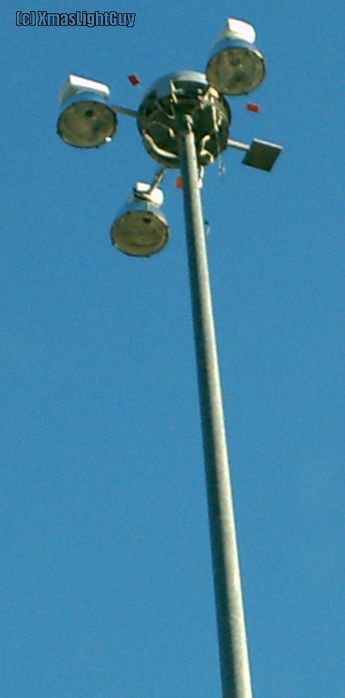 StreetLight #037 - 3-head High-Mast
This one's been sitting on my camera & then computer for a couple months...

High-mast with 3 fixtures on it (not sure the 4th thing is)

Location: Denver International  Airport
Keywords: American_Streetlights