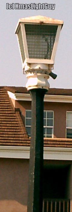 StreetLight #088 - Old? Lantern
Lantern-style light in a small parking lot.
Don't know what type of lamp is in it, but does look somewhat old


Location: 
Littleton CO (Church & Prince)
Keywords: American_Streetlights