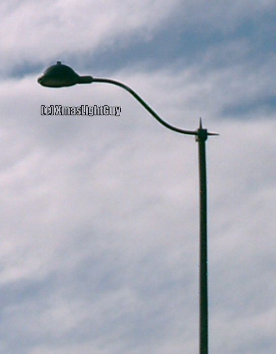 StreetLight #115
Kind of an interesting shaped arm on this one.

Pic ain't the best quality since it was taken from the car (I might eventually try & get a better one)

Location: Near Parker CO
Keywords: American_Streetlights