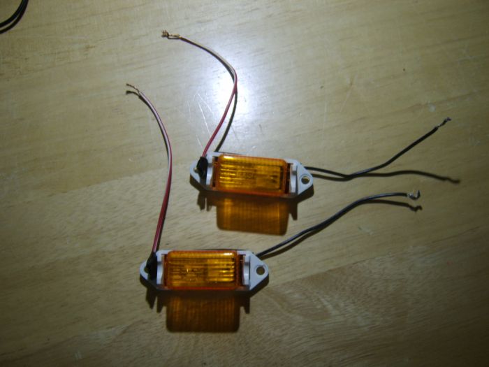 Two Yellow Clearance Lights
These are going to go outside, for the black fence gate door of the dog pen, and these are 12 Volts. Now these are usually go on a trailer. Got these two from Walmart months ago, for a project.
Keywords: Miscellaneous