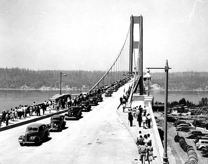 Original Tacoma Narrows Bridge 
This pic was from the 1940 opening of the original Tacoma Narrows bridge before her fateful collapse that November.  What I would like to know is, does anyone have an idea what kind of lights were used on that bridge such as make/model and were they incandescent or LPS?
Keywords: American_Streetlights