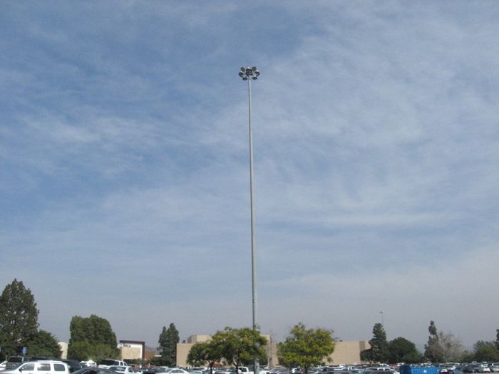 LED High Mast Brea Mall Parking Lot
During my last visit to Brea Mall, I noticed that two of the seven high-mast lighting standards located throughout the parking lot had been fitted with LED fixtures

Having grown up in the area, I recalled the high masts originally had mercury vapor lamp which later became a mix of mercury vapor and high pressure sodium then being all metal-halide in the mid 2000's before this. 
Keywords: American_Streetlights