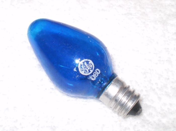 Burned Out General Electric Cool Bright Blue
Here I come across with General Electric Etch D80 Christmas light bulb with larger C7 envelope from one of [url=http://www.lighting-gallery.net/gallery/displayimage.php?pos=-68436]My Collection of Drawer #3[/url].  Unfortunately, this one is already burned out. Because of that, this is the only one with General Electric meatball etch whereas my other D80 bulbs only have '80' etch.
Keywords: Lamps