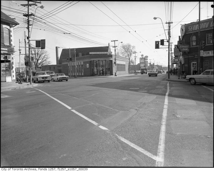Weston and Lawrence
Weston and Lawrence in the early 60s or so. Note the sharp rise arms with the clamshells (arms and clamshells both killed off by HPS), the cable stayed arms for the CGE signals, the neon NO LEFT TURN signs, and finally the neon WALK/DONT WALK lights. The neon pedestrian signals are still largely a mystery to me, I know they were used during the late 50s and early 60s but it seemed the incandescent CGE peds killed them off. 
Keywords: American_Streetlights