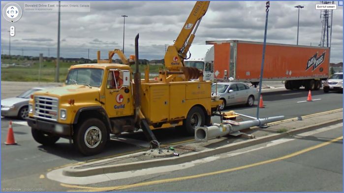 Odd? 
(from street view) Here is the local traffic signal contractor Guild Electric, with the traffic signal and pole on the ground for no explainable reason, I found this rather odd, [url=http://maps.google.com/?ie=UTF8&hq=&hnear=Brampton,+Peel+Regional+Municipality,+Ontario,+Canada&ll=43.7267,-79.764014&spn=0,0.006094&t=h&z=17&layer=c&cbll=43.726554,-79.764088&panoid=DTU6mt7B_4ZHXt9ZjocbZQ&cbp=12,181.44,,0,0.6]  here [/url] is the image from street view. 

Keywords: Traffic_Lights