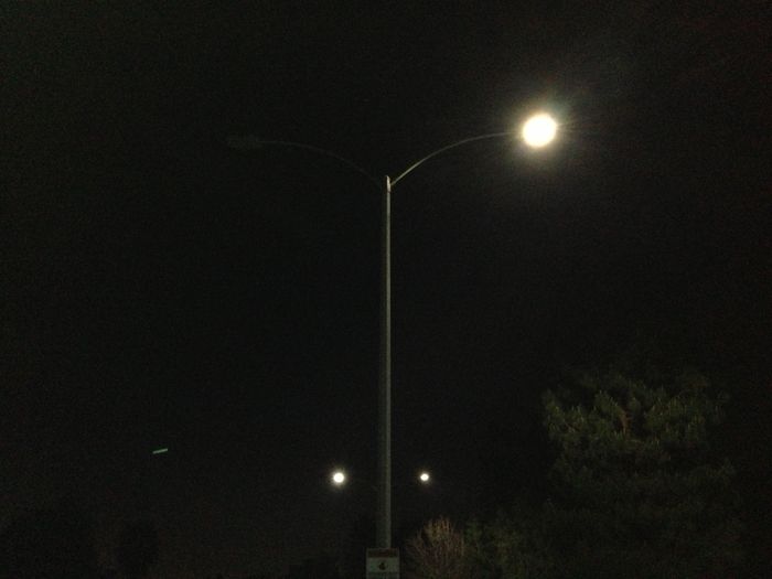 Dead Leotek "toylet" LED street light (on the left)
Ever since Colton, CA began installing several hundred LED street lights beginning in June 2012, all of then Leoteks, I've seen about 7-8 of the lights develop some sort of problems, either failing outright or working on only some nights, out on other nights. I've never seen HID street lights behave like that, except perhaps an old mercury lamp nearing EOL where the starting voltage has risen to the point the ballast OCV can barely strike the lamp. LEDs are weird thats for sure.
Keywords: American_Streetlights